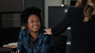 Jazz Raycole as Izzy Letts smiling in The Lincoln Lawyer season 2 episode 8