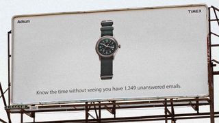 Timex billboard with text reading 'Know the time without seeing that you have 1,249 unanswered emails'