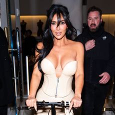 Kim Kardashian rides knee scooter outside SKIMS