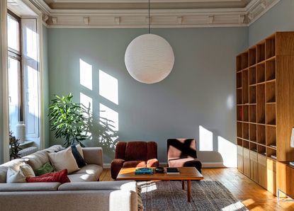 A living room with a large pendant light
