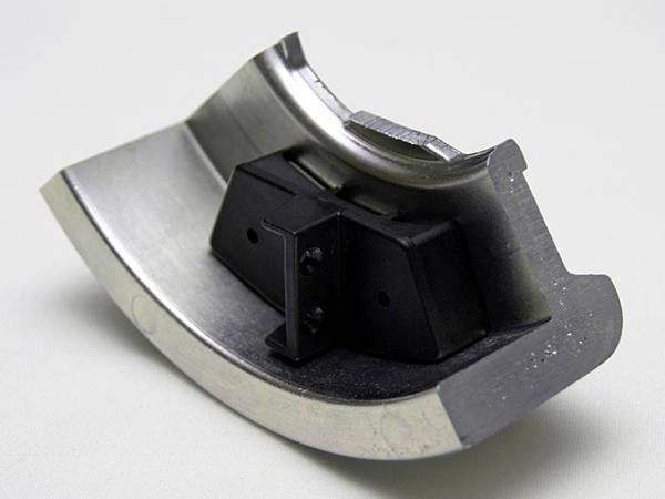 Most of the mass of the flywheels is concentrated on the circumference where it's most effective, thus reducing 'dead weight' towards the center of rotation.