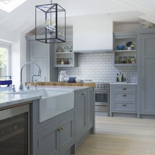 kitchen with grey cabinet and white wall