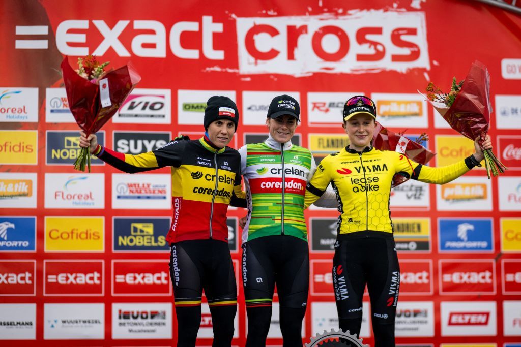 Belgian Sanne Cant, Belgian Marion Norbert Riberolle and British Imogen Wolff celebrate on the podium after the women&#039;s elite race of the cyclocross cycling event, race 5/7 in the &#039;Exact Cross&#039; competition, Friday 27 December 2024 in Loenhout. BELGA PHOTO BILLY CEUSTERS (Photo by Billy Ceusters / BELGA MAG / Belga via AFP)