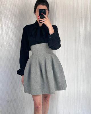 Anna Gray wears a vintage grey Alaïa skirt from Club Vintage.