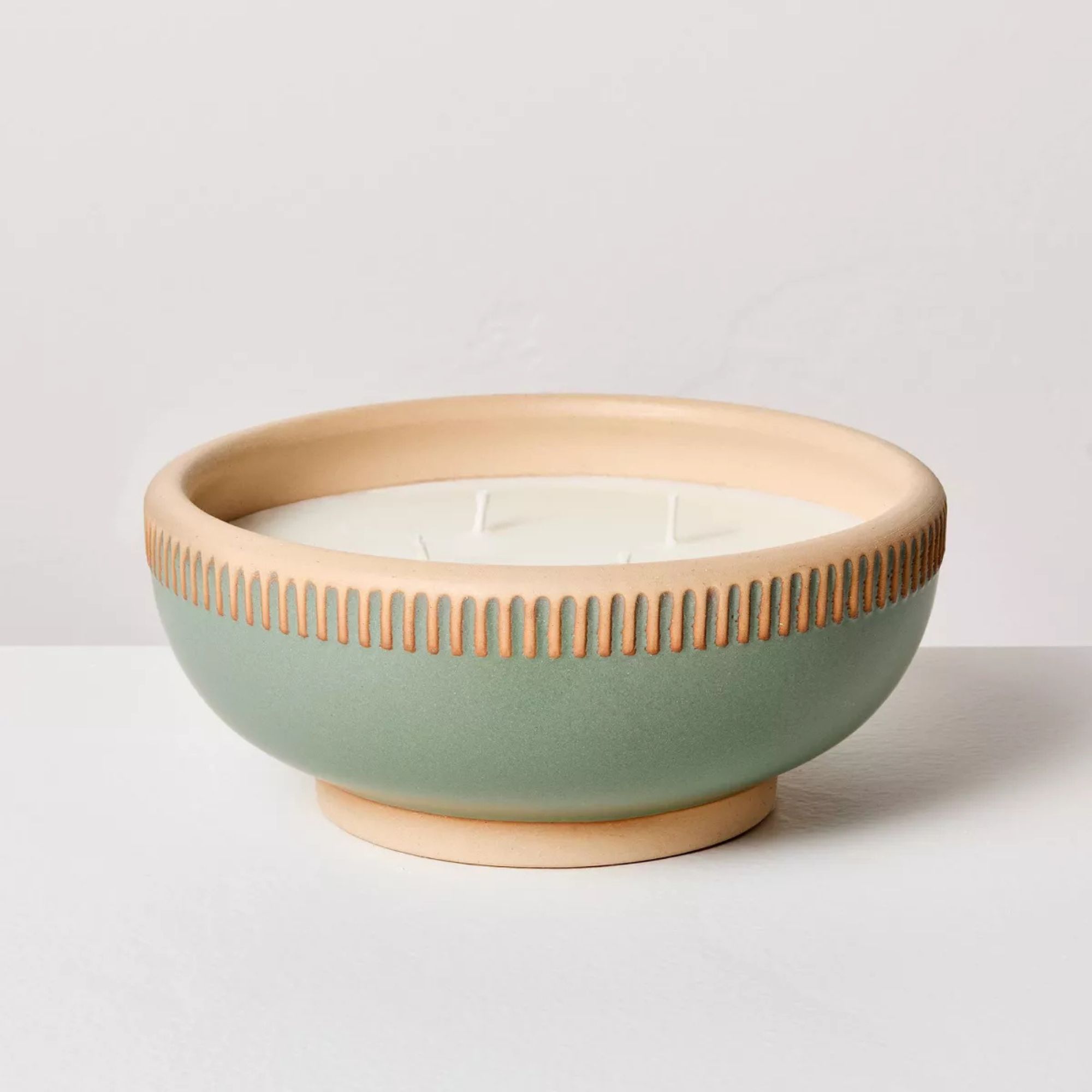 Candle in pale blue bowl with terracotta edges