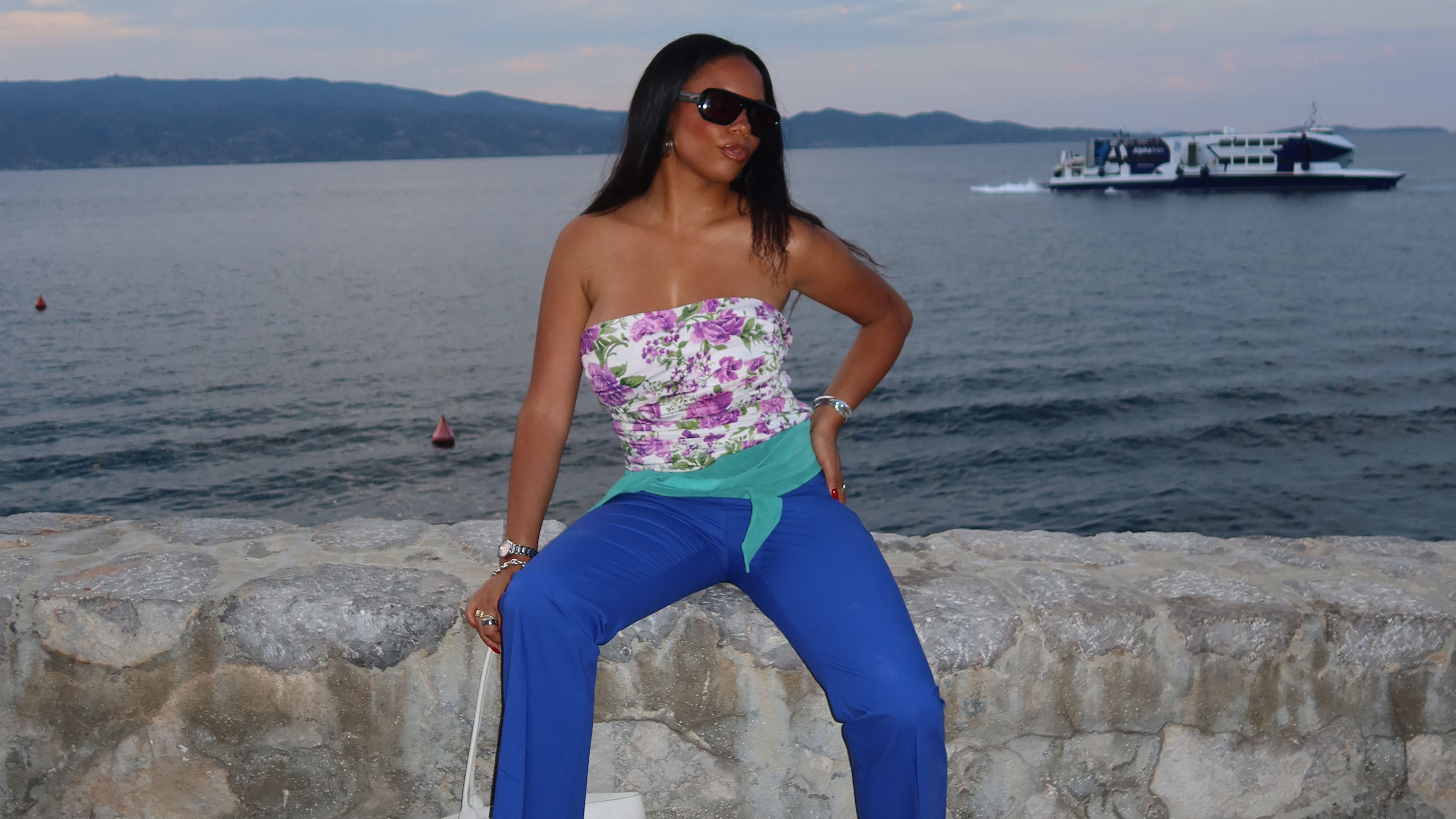 Sierra Mayhew wearing a stylish outfit in Greece.