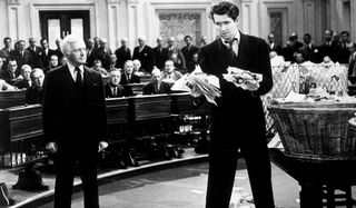 Mr. Smith Goes To Washington Claude Rains at Jimmy Stewart clutching handfuls of letters