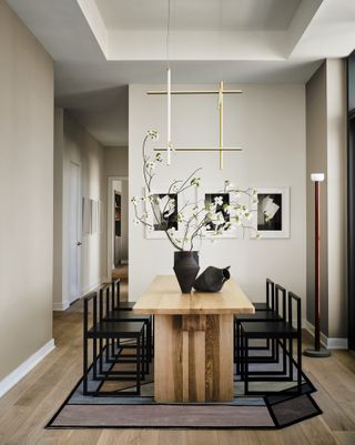 White/gray dining room with wooden table
