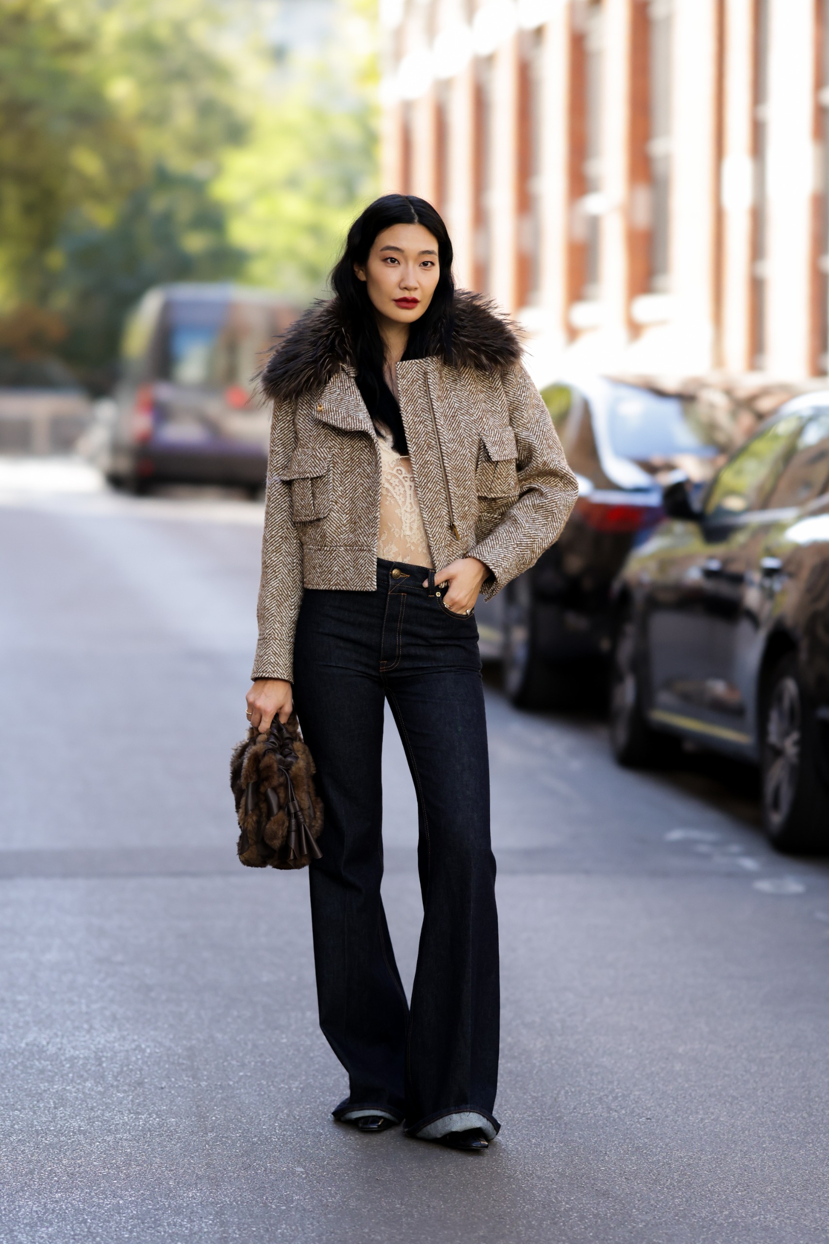 Photo of a Paris Fashion Week guest wearing French girl denim and jeans trends