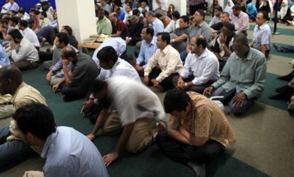 Men attend Friday prayers at the proposed site of the highly controversial Park51 mosque and cultural center.