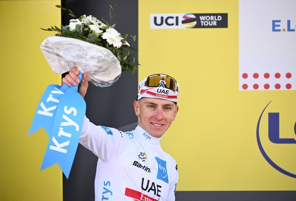 UAE Team Emirates teams Slovenian rider Tadej Pogacar celebrates on the podium with the Best Young rider jersey after the 2nd stage of the 109th edition of the Tour de France cycling race 2022 km between Roskilde and Nyborg in Denmark on July 2 2022 Photo by Marco BERTORELLO AFP Photo by MARCO BERTORELLOAFP via Getty Images