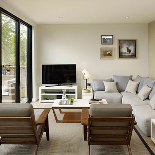 living room with white wall and sofa set