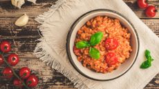 Tomato risotto garnished with a little basil