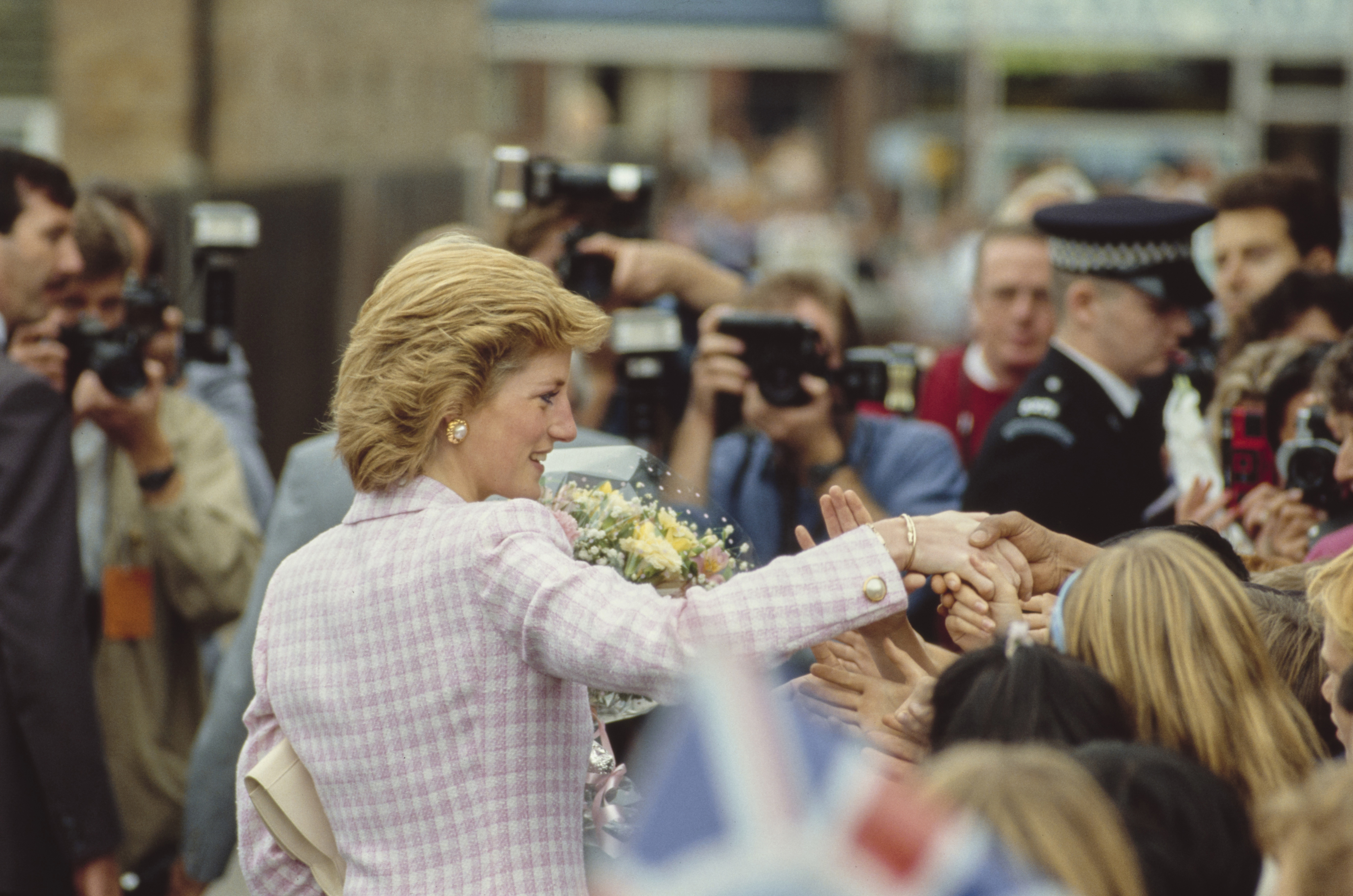 Princess Diana shaking hands with fans