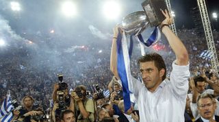 ATHENS, GREECE - JULY 5: Greek national team captain Theodoros Zagorakis raises the trophy during a victory party on July 5, 2004 at Panathenaic Stadium in Athens, Greece. Thousands of Greeks welcomed the new UEFA Euro 2004 Champions upon their arrival to Athens. (Photo by Milos Bicanski/Getty Images)