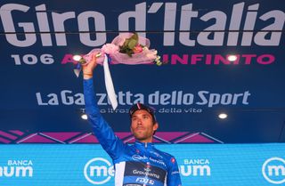 Groupama FDJs French rider Thibaut Pinot celebrates on the podium his best climbers blue jersey after the eighteenth stage of the Giro dItalia 2023 cycling race 161 km between Oderzo and Val di Zoldo on May 25 2023 Photo by Luca Bettini AFP Photo by LUCA BETTINIAFP via Getty Images