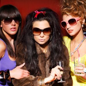 three made up women with drinks