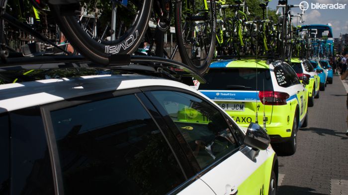 Every day of the Tour starts with a seemingly endless procession of bike-topped team cars and tinted-glass buses