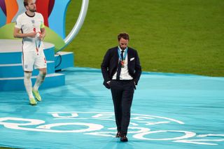 Gareth Southgate and England captain Harry Kane, left, collect their Euro 2020 runners-up medals