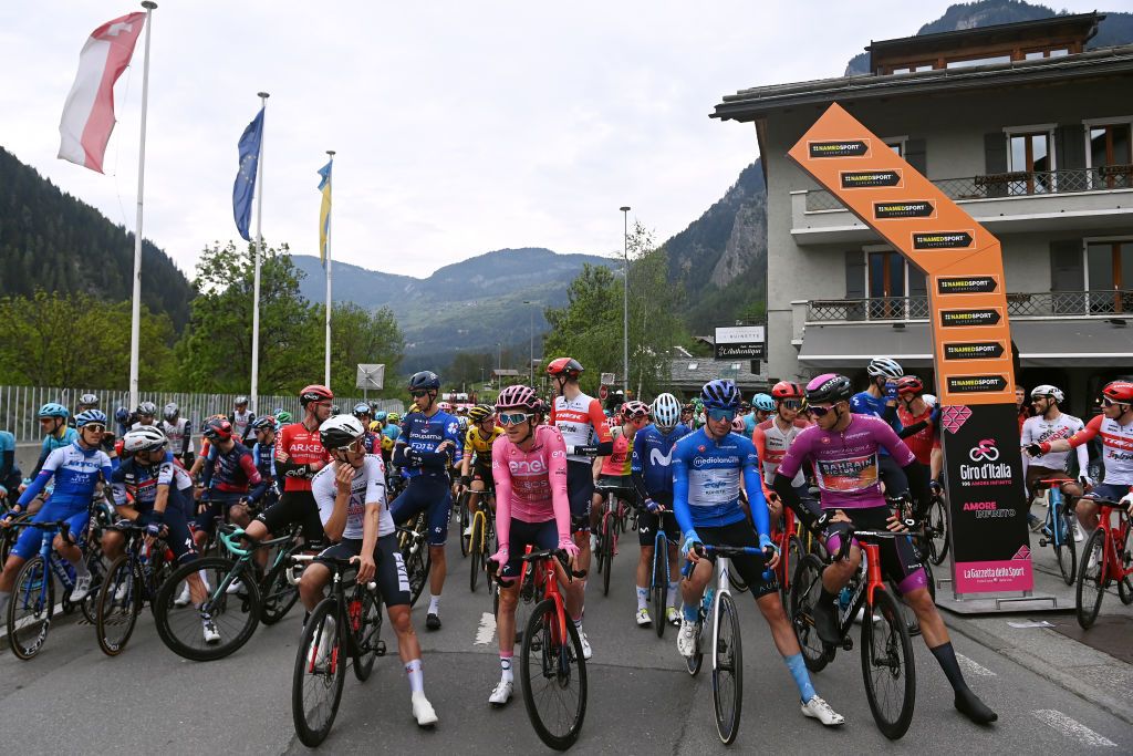 LE CHABLE SWITZERLAND MAY 19 LR Joo Almeida of Portugal and UAE Team Emirates White Best Young Rider Jersey Geraint Thomas of The United Kingdom and Team INEOS Grenadiers Pink Leader Jersey Davide Bais of Italy and Team EOLOKometa Blue Mountain Jersey and Jonathan Milan of Italy and Team Bahrain Victorious Purple Points Jersey prior to the 106th Giro dItalia 2023 Stage 13 a 75km stage from Le Chable to CransMontana Valais 1456m Stage shortened due to the adverse weather conditions UCIWT on May 19 2023 in CransMontana Switzerland Photo by Tim de WaeleGetty Images