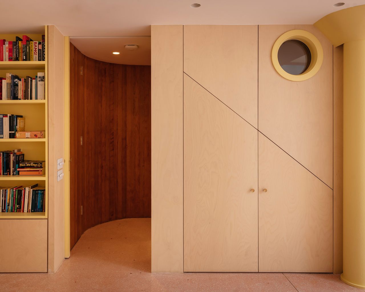 under stairs storage with a porthole window