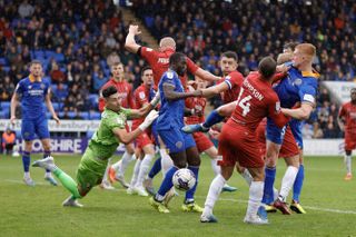 Cheltenham Town in action against Shrewsbury Town in League One, August 2023