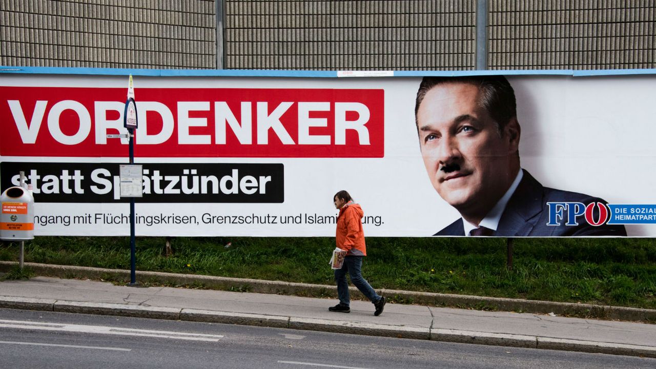 Freedom Party leader Heinz-Christian Strache with a graffiti Hitler moustache 