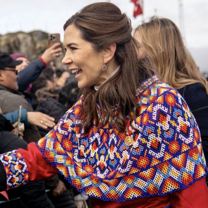 Denmark's Queen Mary (R) meets with local residents upon arriving in Sisimiut, Greenland, on July 2, 2024. The royal couple officially visits Greenland from the 29th of June to the 6th of July 2024.