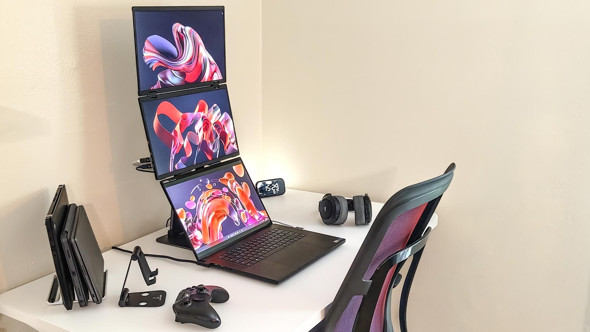 A triple screen setup using the UPERFECT UStation Delta dual-screen portable monitor and a laptop