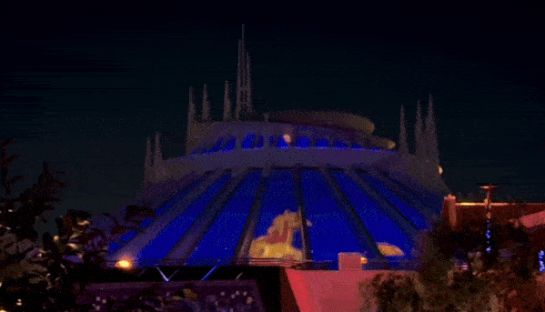 The Human Torch blazes a 4 into the sky on the side of Space Mountain in Disney.