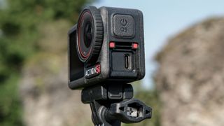 The DJI Osmo Action 5 Pro against an outdoors background