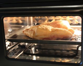 Cooking frozen puff pastry filled with strawberry jelly in the Our Place Wonder Oven air fryer