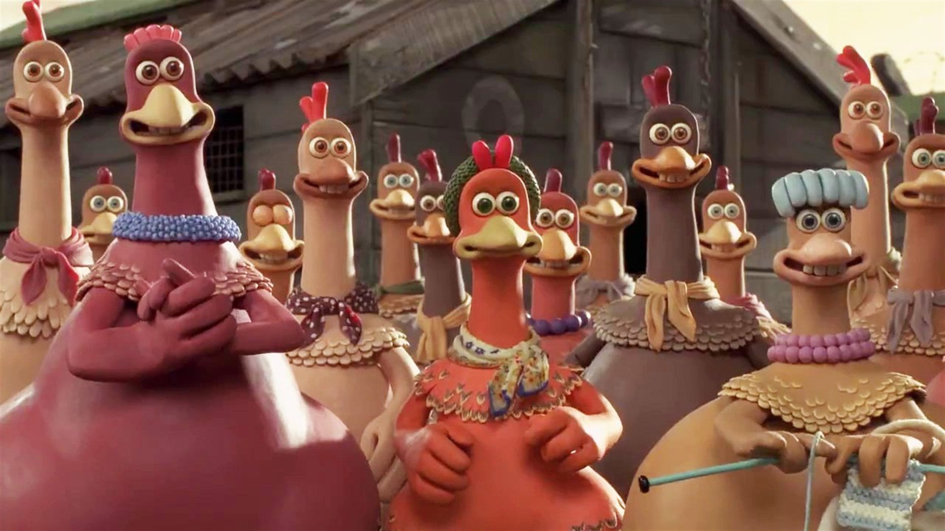 A bunch of chickens stand around in a pen in Chicken Run