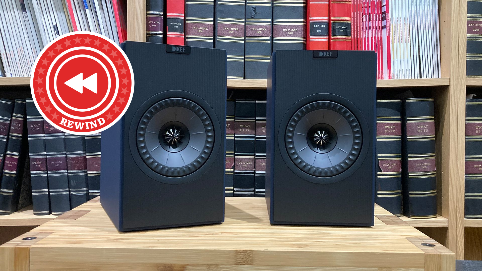 KEF speakers on table with Rewind logo