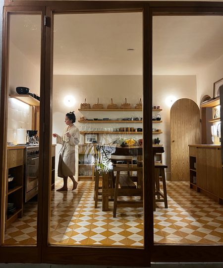 A store front in Mexico looking into a shop filled with wooden boards