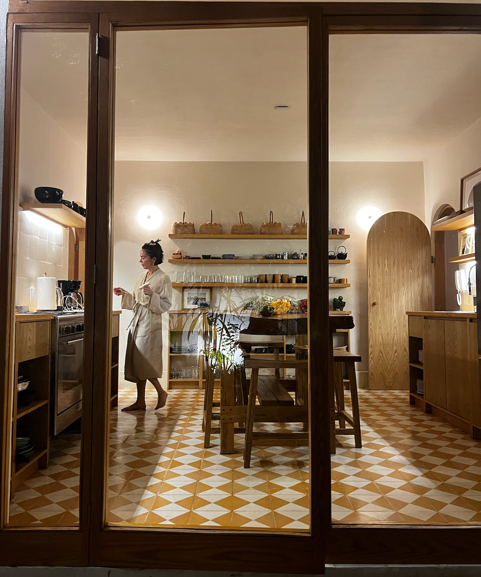 A store front in Mexico looking into a shop filled with wooden boards