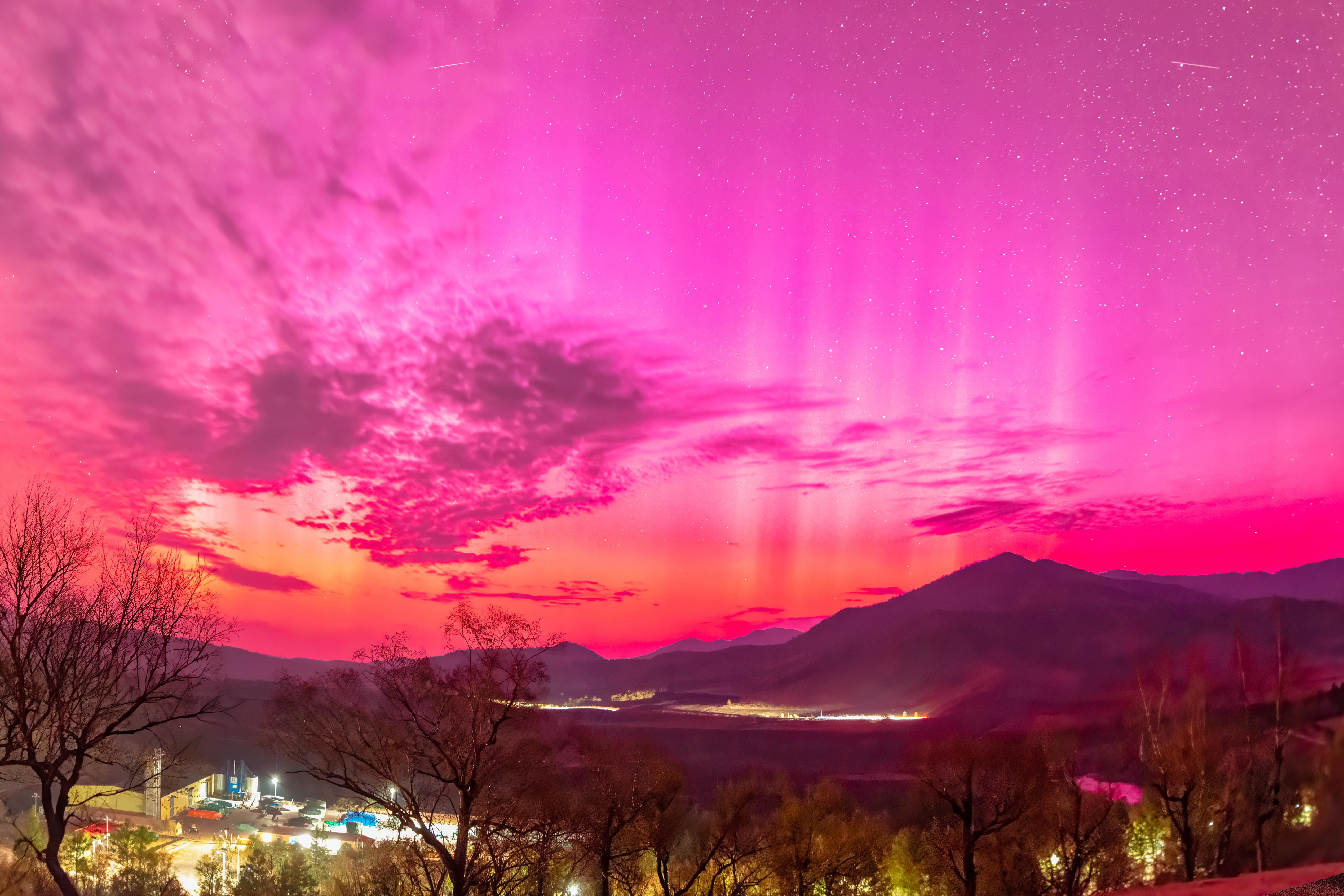 A bright pink sky over Hulunbuir city in China.