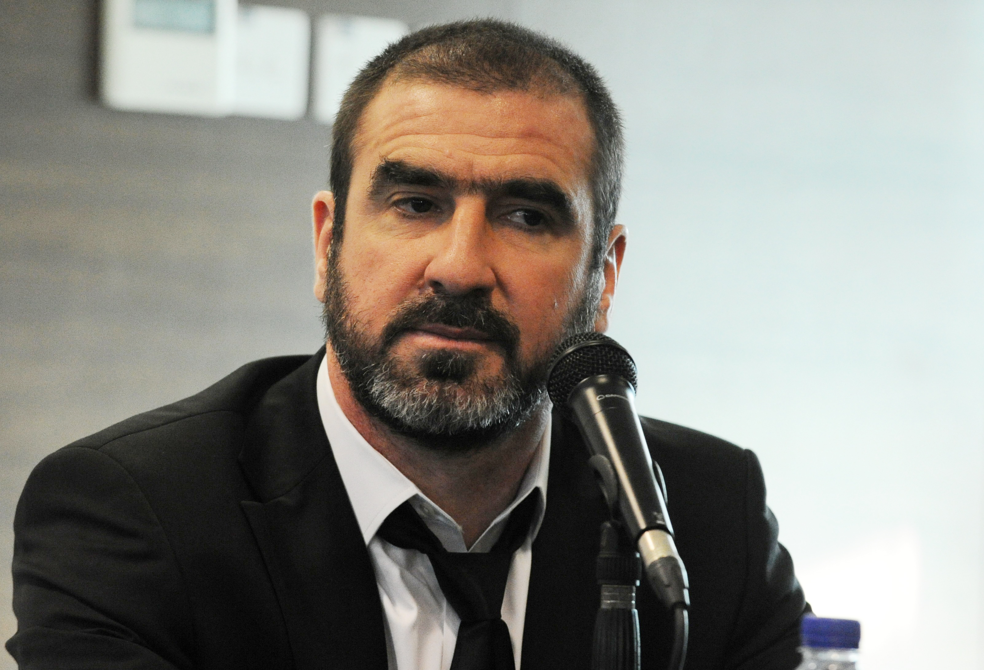 Eric Cantona attends a press conference in 2011.