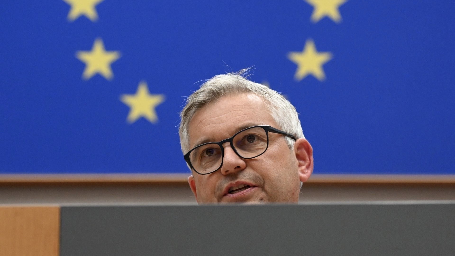 EU Commissioner for Internal Affairs and Migration Magnus Brunner delivers a speech during a session of the European Parliament in Brussels, on November 12, 2025. 