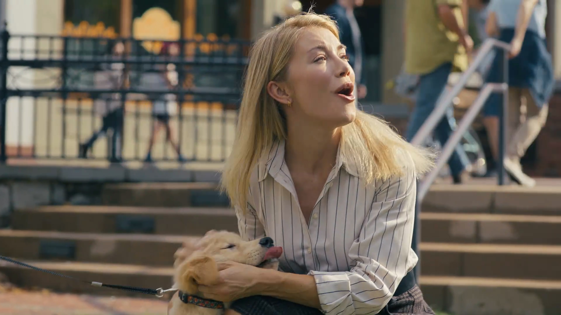 Emilia Harcourt 2 petting a puppy in Peacemaker season 2 episode 3