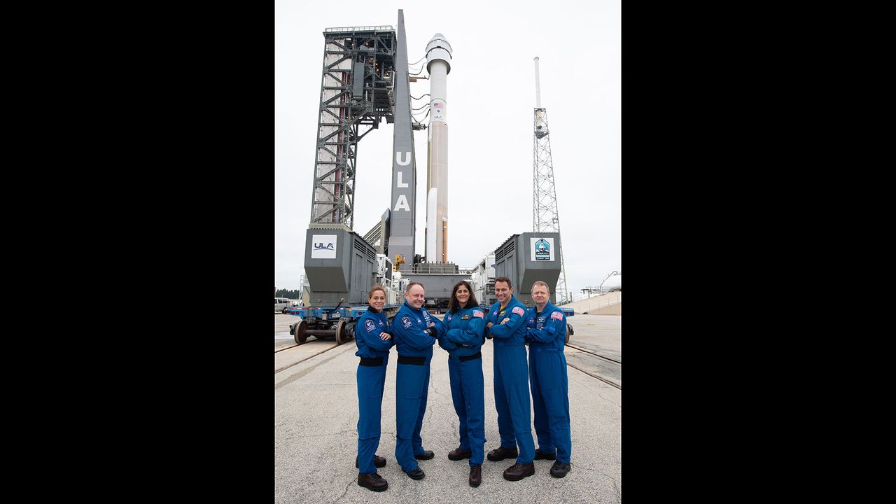 NASA astronauts Nicole Mann, Michael Fincke, Suni Williams, Josh Cassada, and Eric Boe pose for a picture after a United Launch Alliance Atlas V rocket with Boeing&rsquo;s CST-100 Starliner spacecraft onboard was rollout out to the launch pad at Space Launch Complex 41 ahead of the Orbital Flight Test mission, Wednesday, Dec. 18, 2019 at Cape Canaveral Air Force Station in Florida.