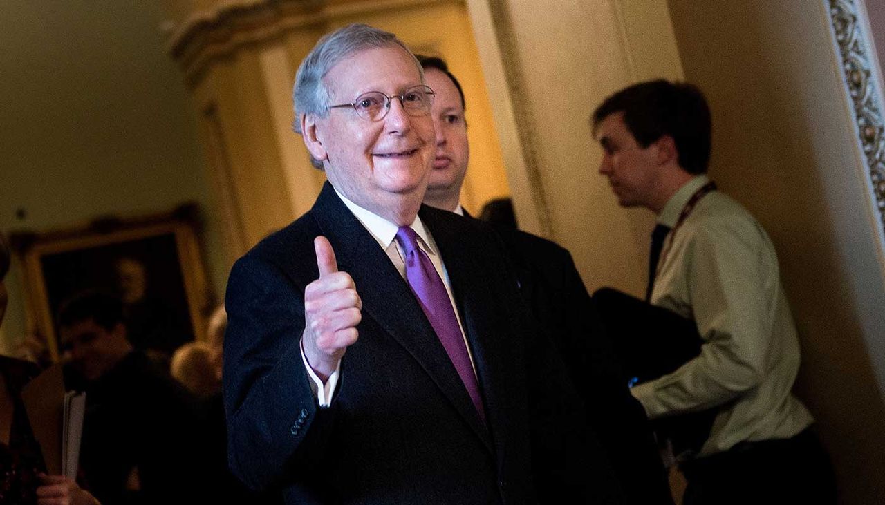 Republican senate leader Mitch McConnell celebrates passing of funding bill