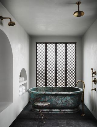 A bathroom with a stone tub