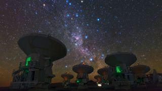 the antennas of the Atacama Large Millimeter/submillimeter Array (ALMA), set against the splendour of the Milky Way