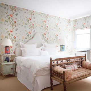 Bright bedroom with floral wallpaper