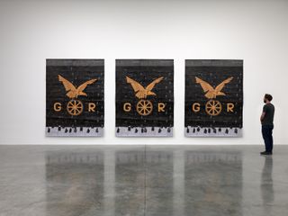 Black and orange artwork by Ibrahim Mahama, featuring bats, at White Cube gallery