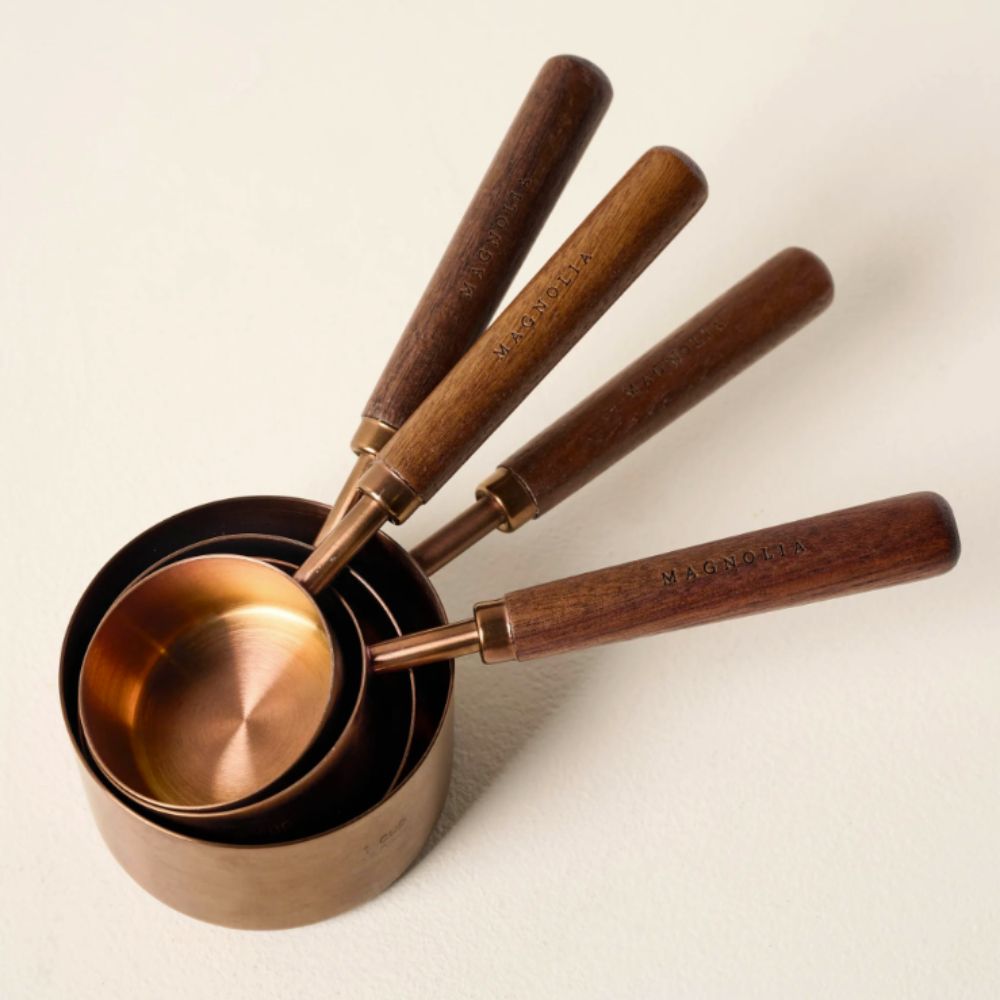 Copper measuring cups with walnut wood handles