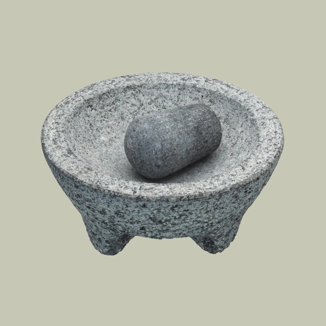 Kitchencraft Granite Pestle &amp;amp; Mortar sits against a pale green background.