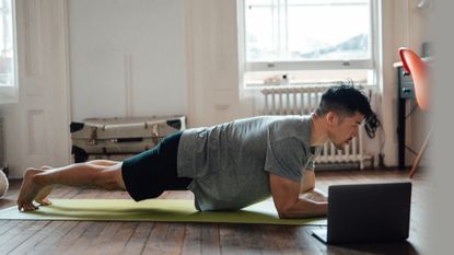 Man holding a plank