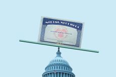 A Social Security card balances on top of the U.S. Capitol